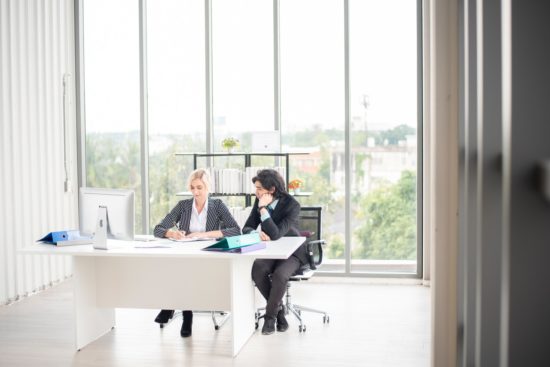 man and woman closing a business deal