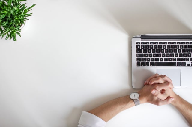 man waiting for computer to load