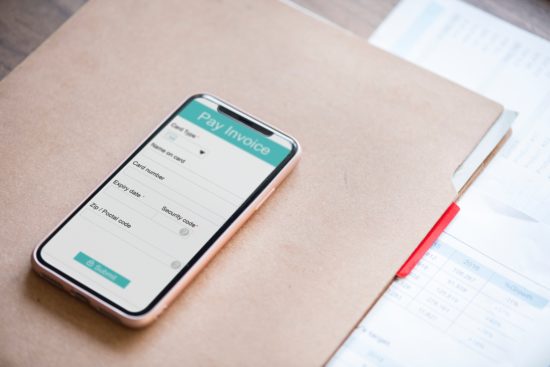 phone with mobile banking app showing on screen