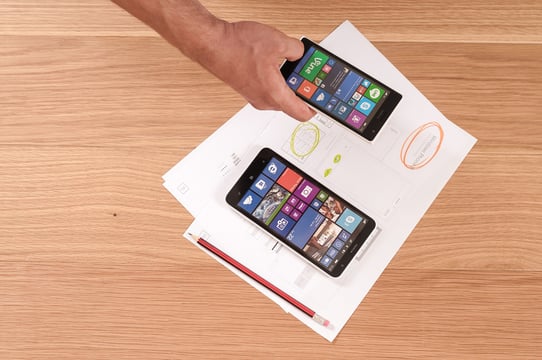 Mobile phones with mobile app icons in a menu design
