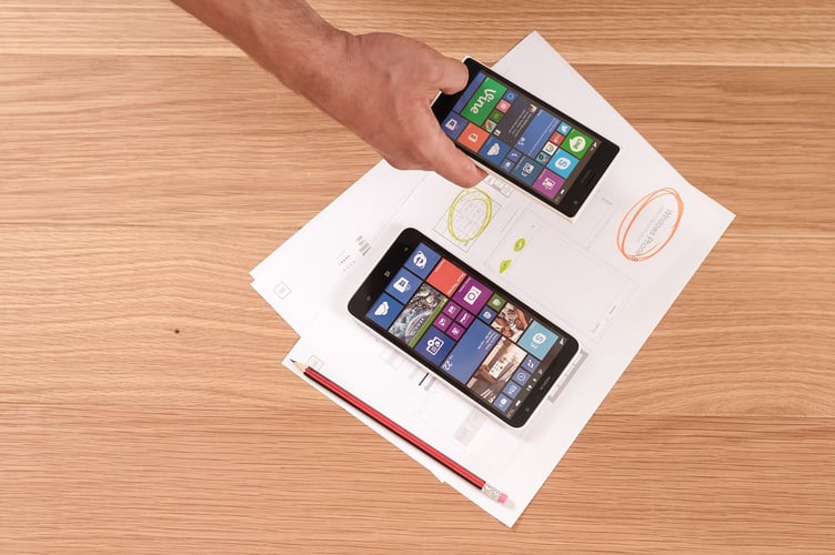 Mobile phones with mobile app icons in a menu design