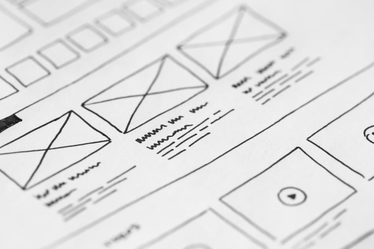 Close-up of hand-drawn user experience wireframes and layouts