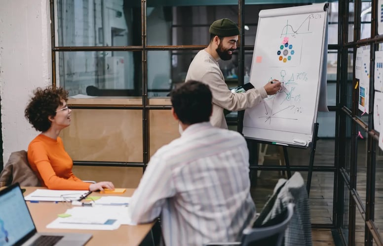 Group of people brainstorming ideas in a conference room.