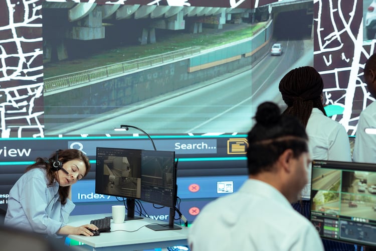 Background image of Frustrated employee working under pressure in agency control center