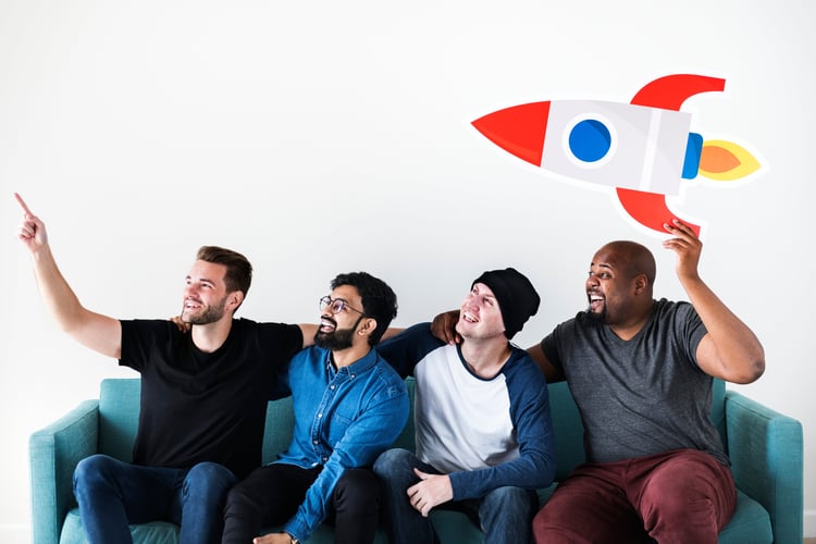 Background image of Group of diverse friends sitting on couch with spaceship icon