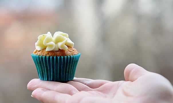 Person holding a cupcake