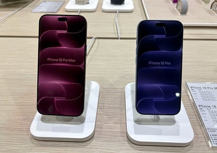 iPhone 18 Pro Max on the left and iPhone 18 Pro on the right, on display in a store