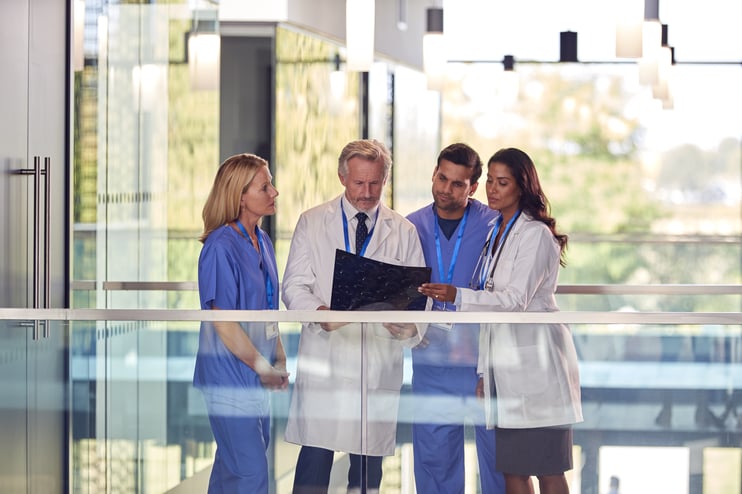 multi-cultural-medical-team-wearing-white-coats-an-2023-11-27-05-08-01-utc