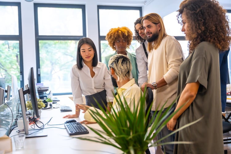 Background image of Multi-ethnic coworkers using computer in a informal meeting