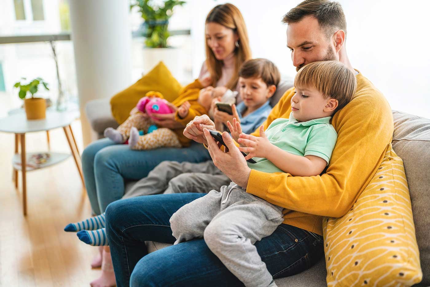 parents-with-children-playing-games-using-mobile-2021-09-04-02-41-17-utc