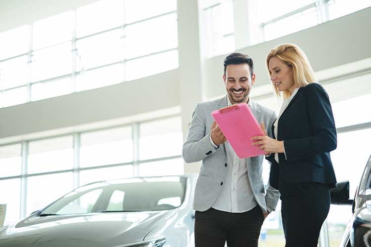 portrait-of-happy-customer-buying-new-car-2021-08-26-17-32-10-utc