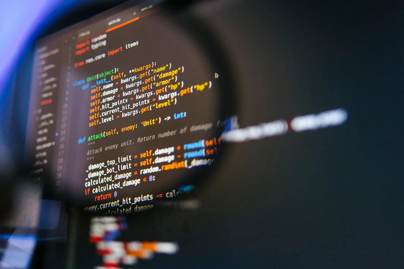 program-code-on-computer-display-in-magnifying-gla-2022-04-28-02-46-28-utc