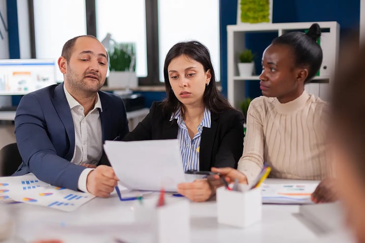 successful-businessman-and-coworkers-discussing-in-2021-10-20-00-41-21-utc