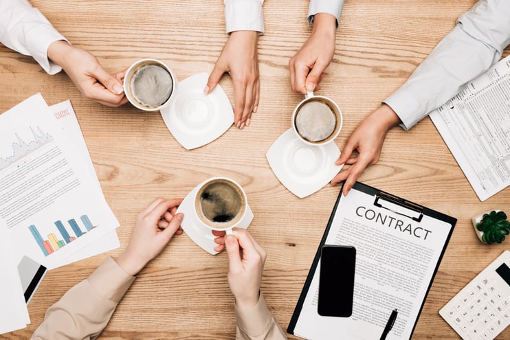 top-view-of-businesswomen-and-businessman-drinking-2023-11-27-05-02-03-utc