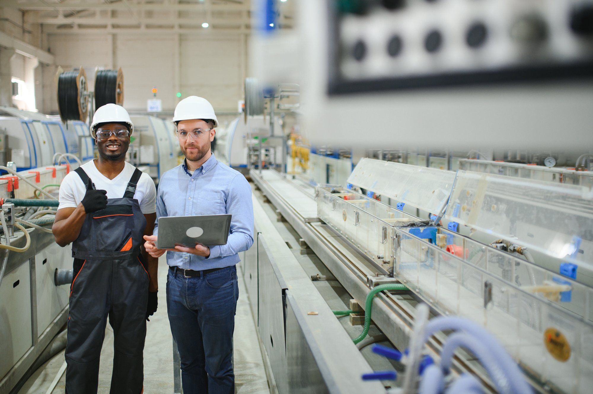 two-heavy-industry-engineers-stand-in-factory-2025-03-15-23-05-42-utc two-heavy-industry-engineers-stand-in-factory-2025-03-15-23-05-42-utc