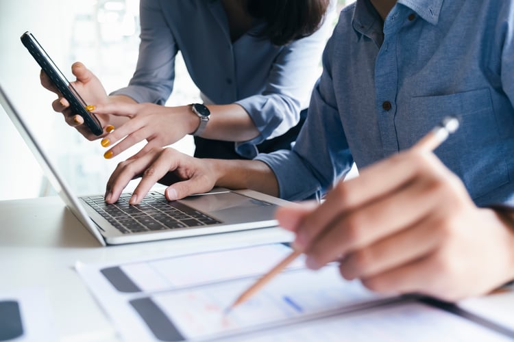Developers working together on a mobile website