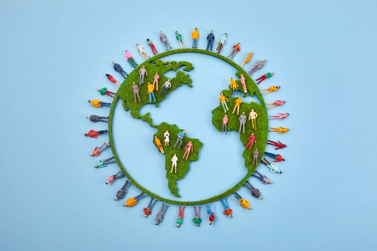 Background image of World Population Day, creative concept. Large and diverse group of people in the shape of the world